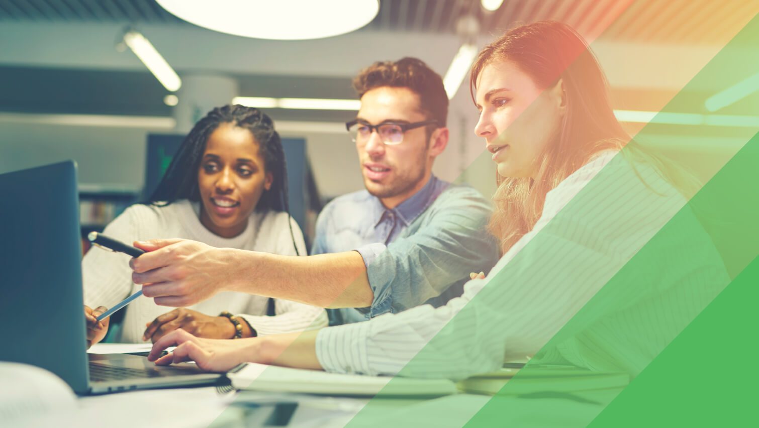 Three team members at a cybersecurity marketing agency work together on client strategy.